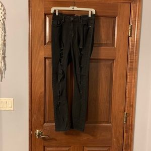 Distressed black skinny jeans
